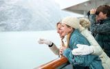 A family enjoying views of Holland America's privileged access to Glacier Bay National Park and Preserve