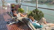 The sweeping sun deck on the Raj Mahal is lined with comfortable seating.