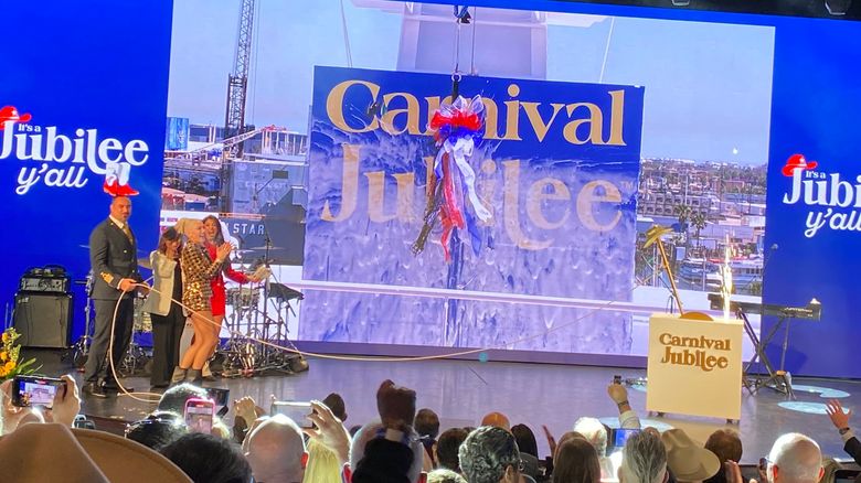 Carnival Jubilee godmother Gwen Stefani and others celebrate after a bottle of Champagne is smashed into the ship's bow.