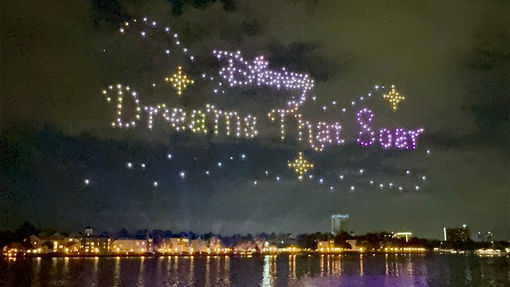 Drones spell out the name of the nighttime show at Disney Springs.