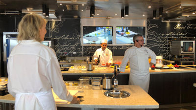 Chef John Stephano leads a class in the Culinary Arts Kitchen onboard the Seven Seas Grandeur.