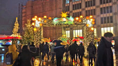 A Christmas market entryway in Cologne, Germany, next to the city's famous cathedral.