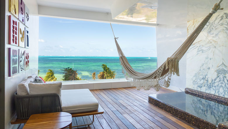 A suite terrace with a sea view at the Hotel Mousai Cancun.