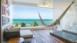 A suite terrace with a sea view at the Hotel Mousai Cancun.