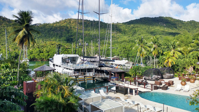 Zoetry Marigot Bay St. Lucia; looking at Marigot Bay and the pool. The Zoetry Marigot Bay is one of the participating hotels in Pleasant Holidays' vacation package discount offer.