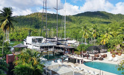 Zoetry Marigot Bay St. Lucia; looking at Marigot Bay and the pool. The Zoetry Marigot Bay is one of the participating hotels in Pleasant Holidays' vacation package discount offer.