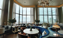 The dining room at Amar at the Raffles Boston, with views of the Back Bay area.