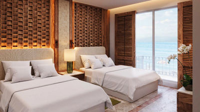 A room model featuring the suite bedroom at the Paraiso de la Bonita, a Luxury Collection resort.