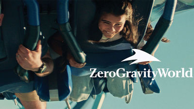 An overlay of text describes the different "worlds" a family is exploring, like "ZeroGravityWorld" for a roller coaster ride.