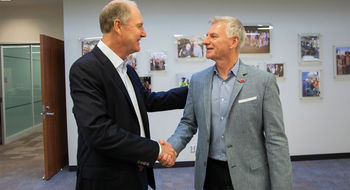 Southwest CEO Bob Jordan (right) shakes hands with former CEO and current chairman Gary Kelly in February 2022. An activist investment firm is calling for both to be removed.