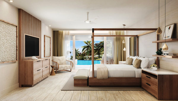 The bedroom of a signature swim-up suite at the Sandals Saint Vincent and the Grenadines.