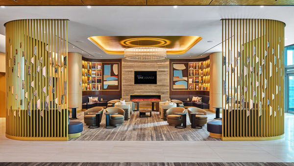 The Delta One Lounge has design touches like Missoni accent pillows, vases and coffee table books.