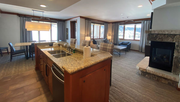 The kitchen and living room in a three-bedroom villa.