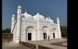 The white-washed 18th-century mosque of Khushbagh is set in the garden-cemetery of the Nawabs of Bengal, near the western banks of Hooghly River.