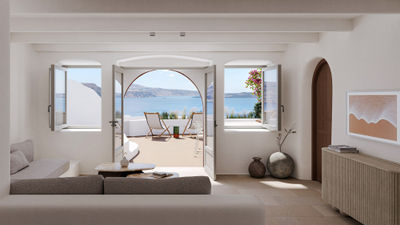 Accommodations at the Canaves Ena feature private balconies with views of the Santorini caldera and the Aegean.